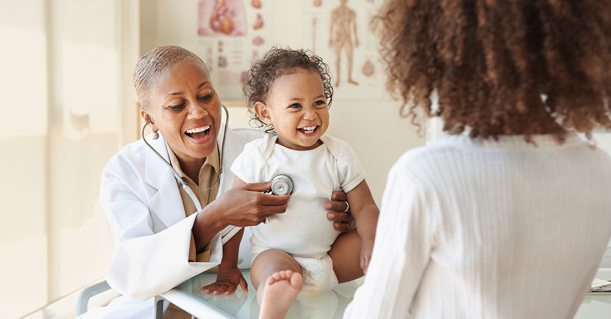 Baby and mother in appointment with doctor