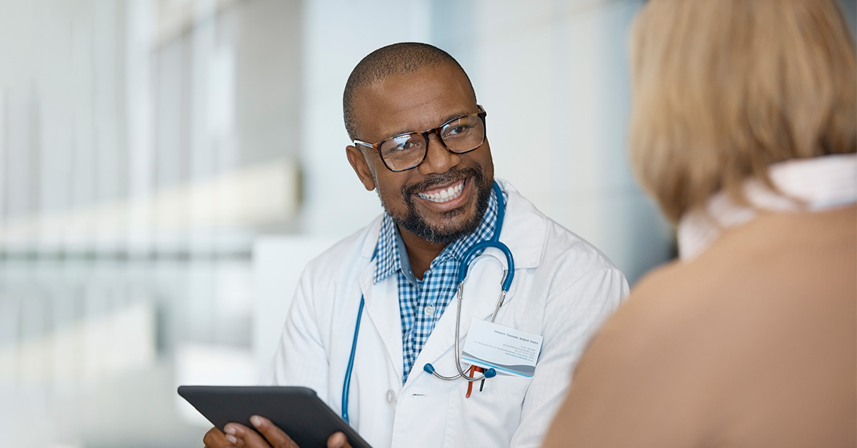 Doctor smiles at patients