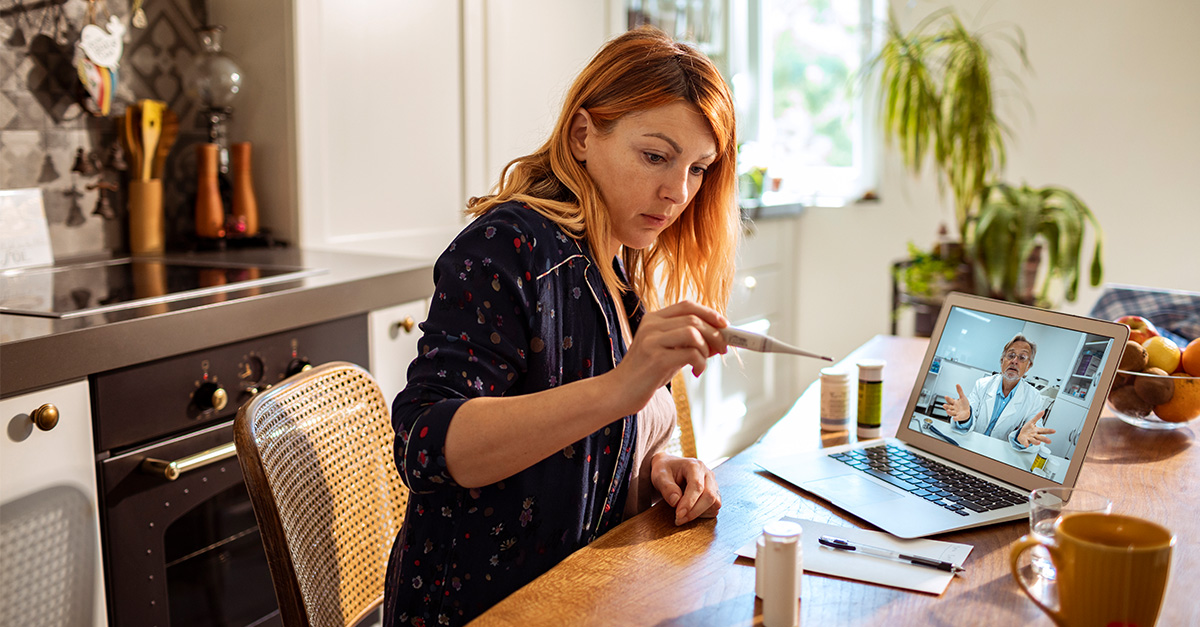 Woman using thermometer